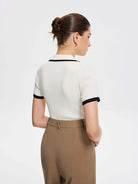 Lavinque Tops Polo Ajusté Blanc à Détails Noirs | Zippé & Chic | Élégance Moderne