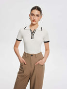 Lavinque Tops Polo Ajusté Blanc à Détails Noirs | Zippé & Chic | Élégance Moderne